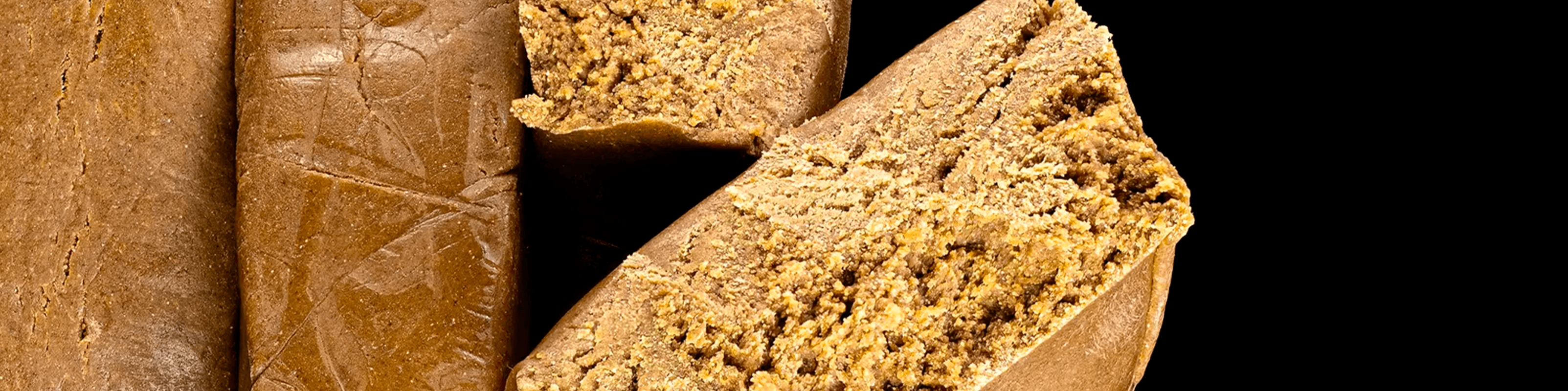 Golden-brown bubble hash blocks with a crumbly interior texture, shown in close-up.