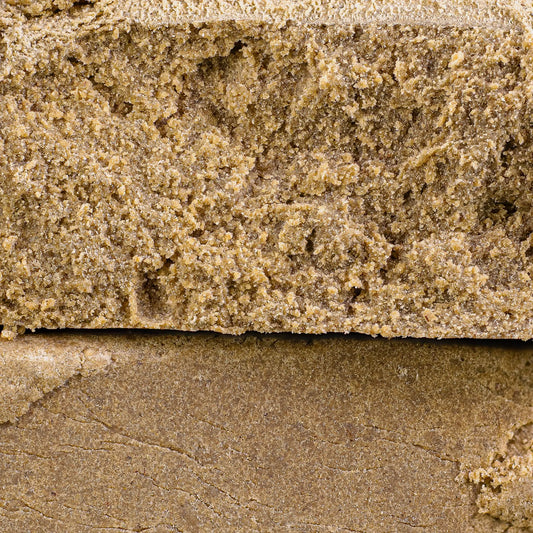 Close-up of a thca dry sift hash with visible texture