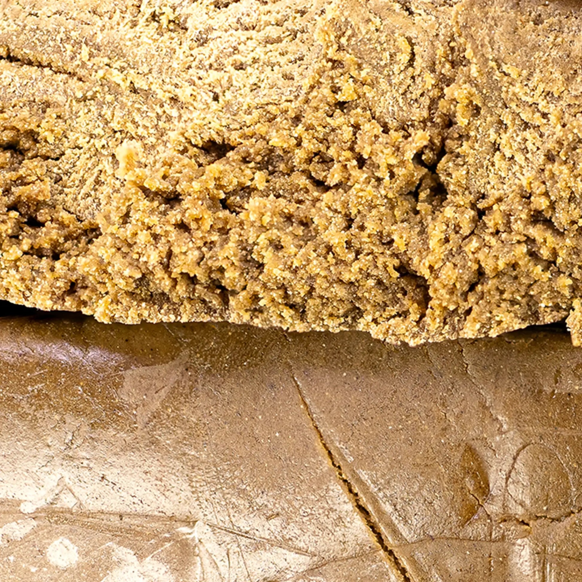 Close-up of Bubble Hash THCA showing light golden resin structure