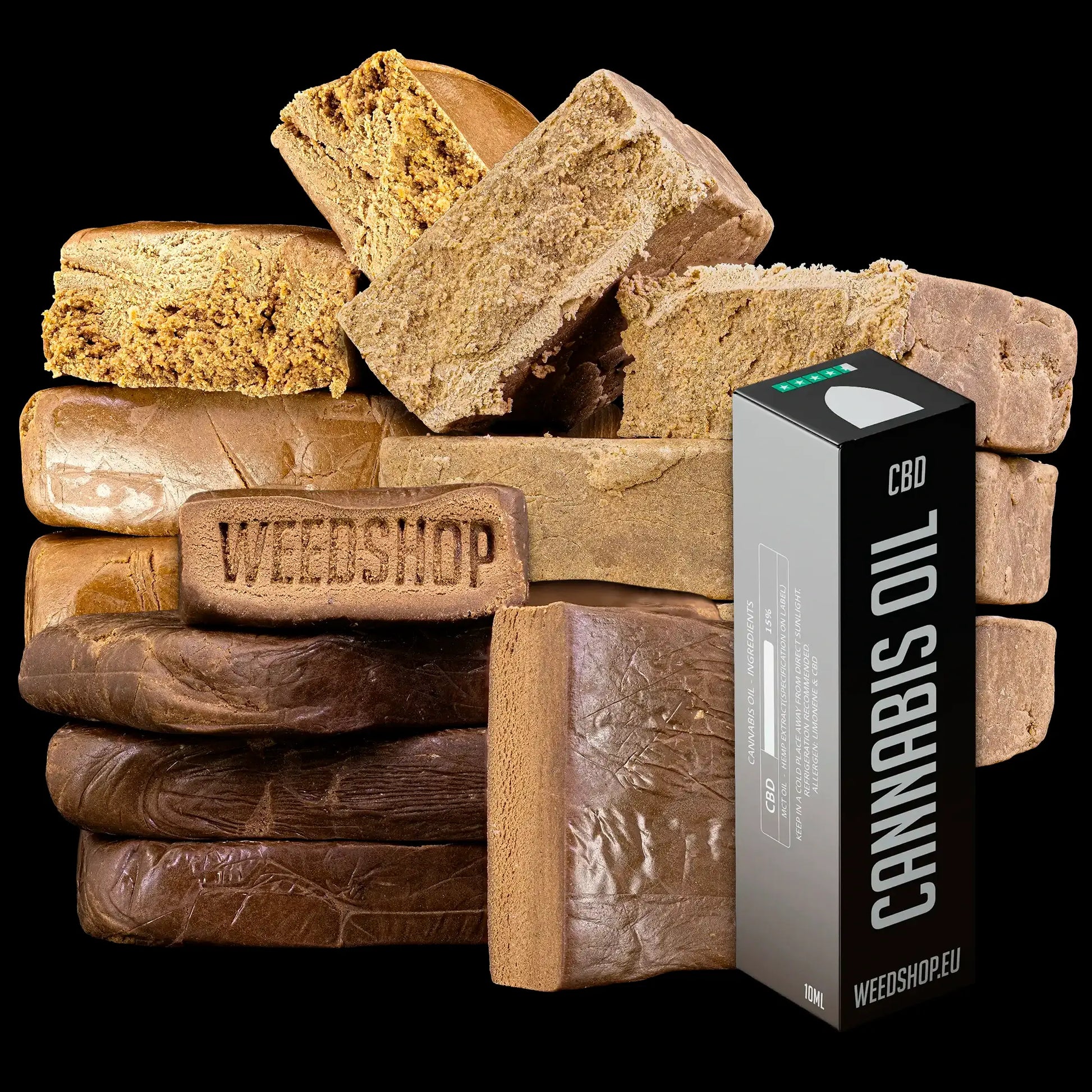 Stack of brown hash bars labeled 'Weedshop' with a cannabis oil container on a black background