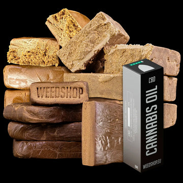 Stack of brown hash bars labeled 'Weedshop' with a cannabis oil container on a black background